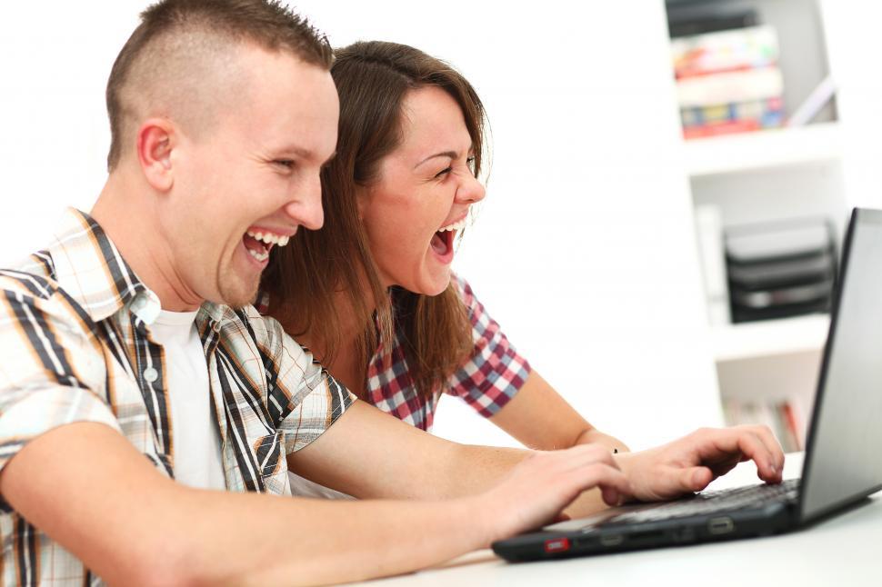 Free Image of Two people enjoying content on a computer 