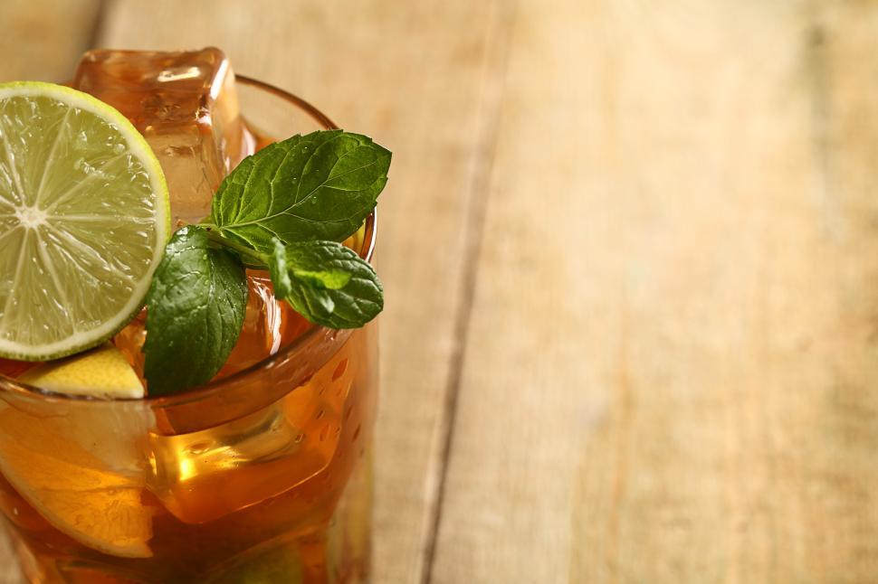 Free Image of Glass of iced tea with lime and mint, with copyspace 