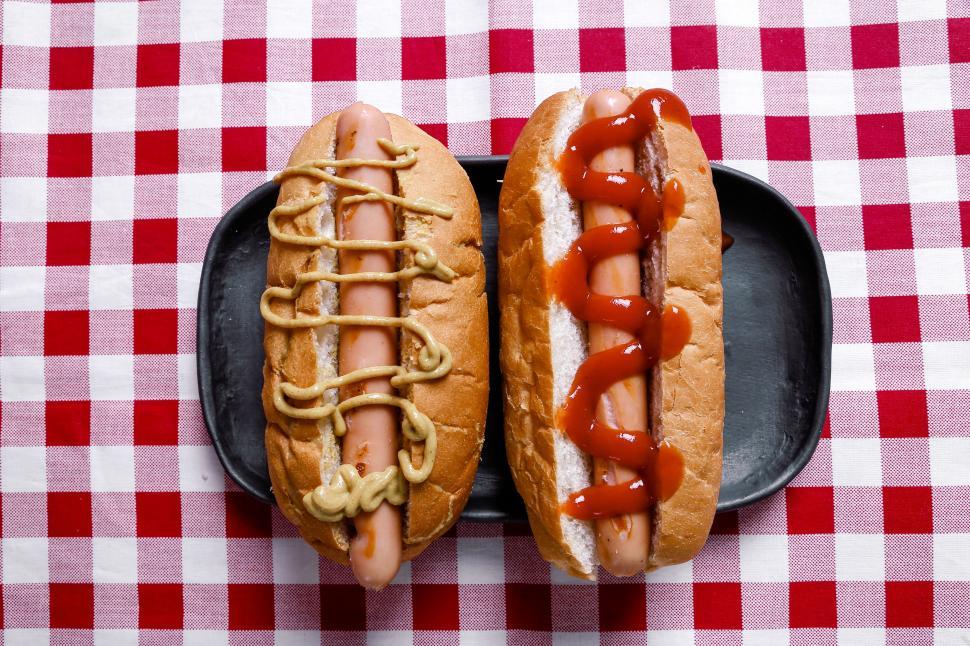 Download Free Stock Photo of Hot dogs on red and white checkered tablecloth 