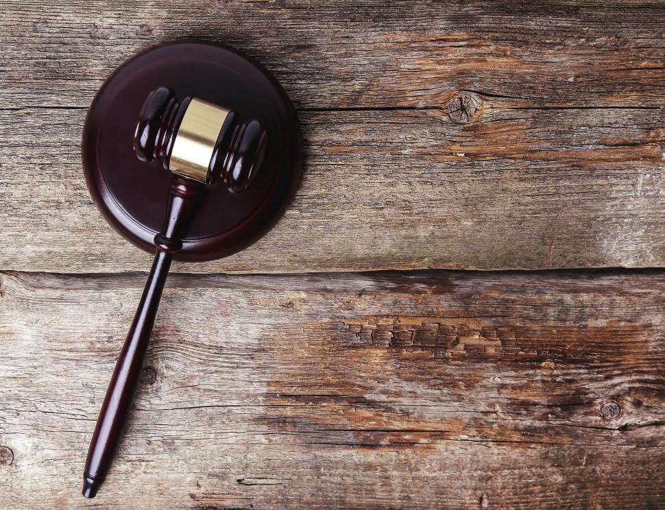 Free Image of Gavel on a wooden table, with copyspace 