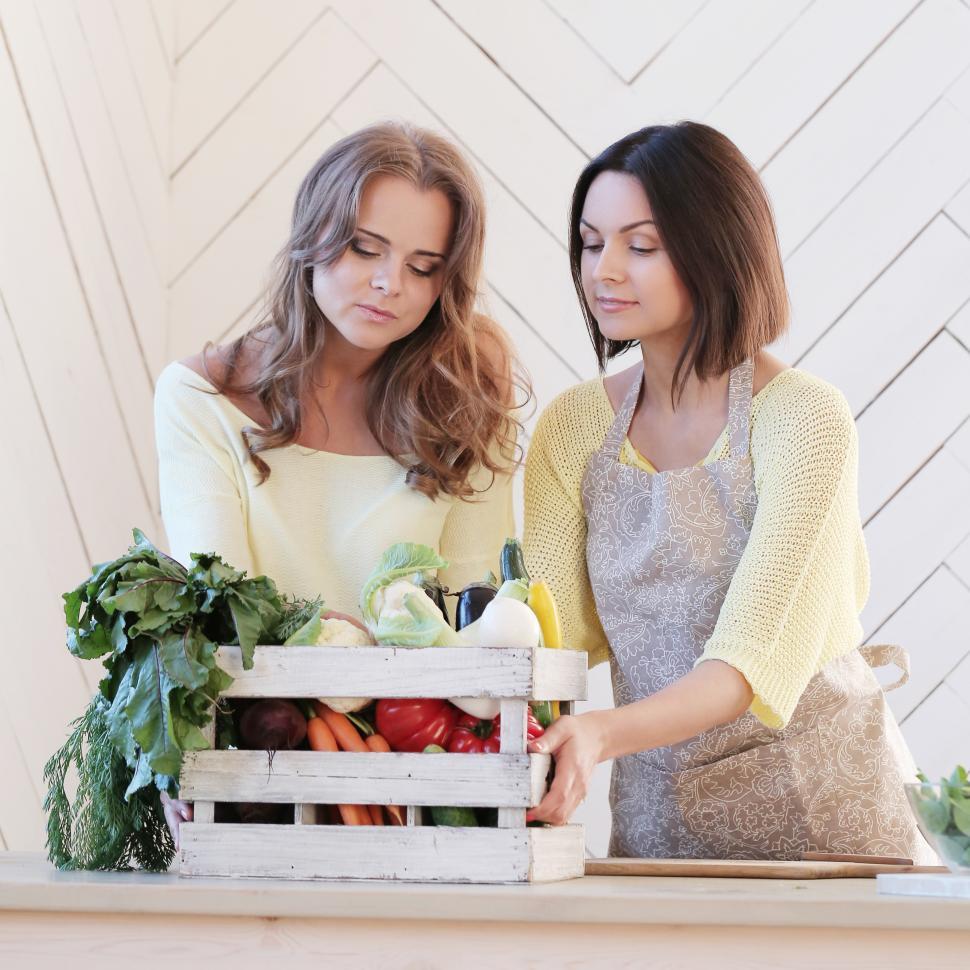 Free Image of Best friends and a crate of vegetables 