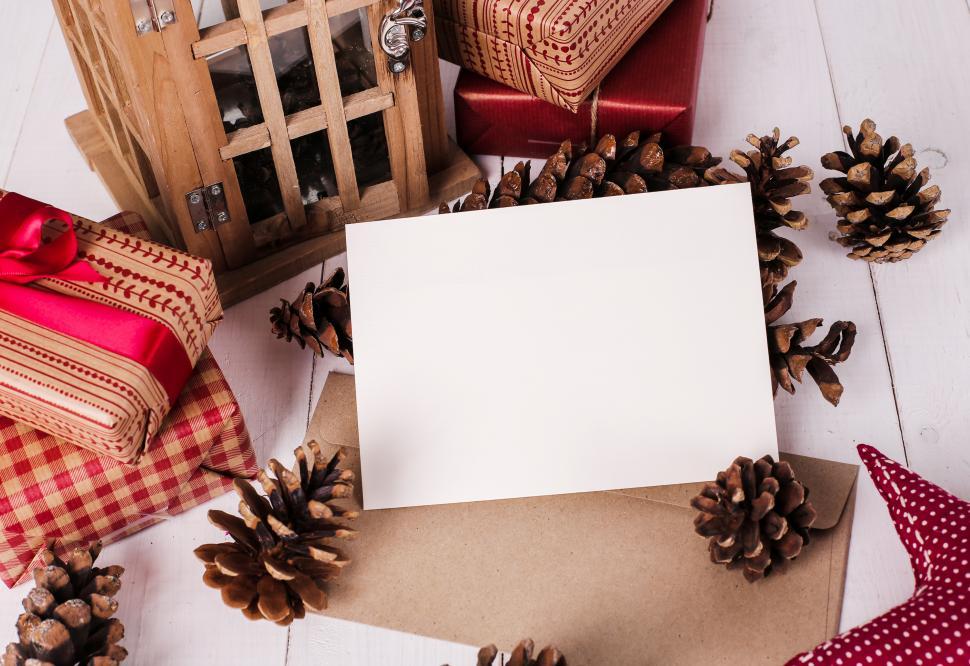 Free Image of Blank Christmas card and surrounding decorations 