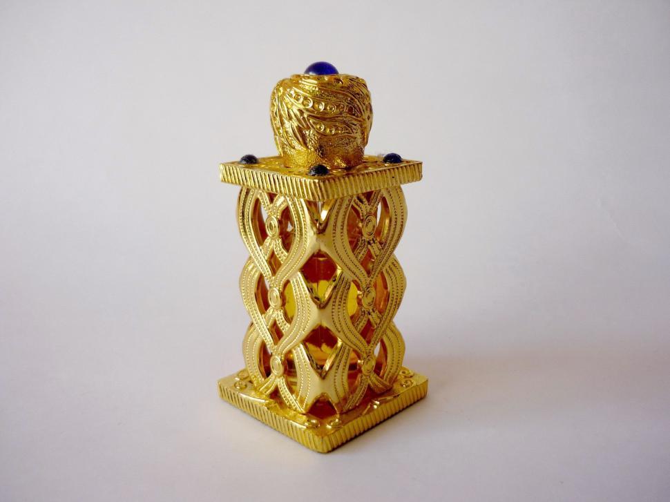 Free Image of Golden Candle Holder With Blue Candle 