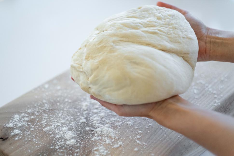 Free Image of Hands and dough 