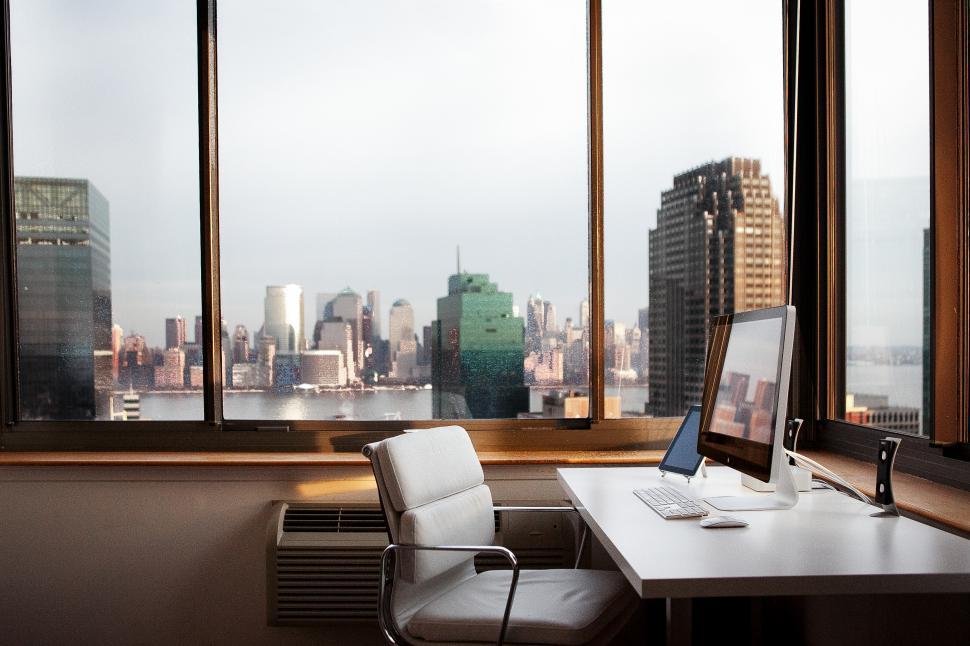 Download Free Stock Photo of Office interior with glass windows and city buildings 