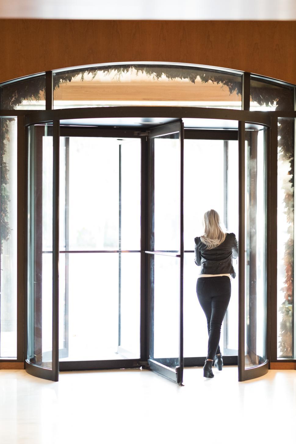 Free Image of Backside view of woman at the entrance door 