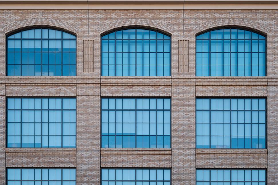 Free Image of Facade of brick wall building with glass windows 