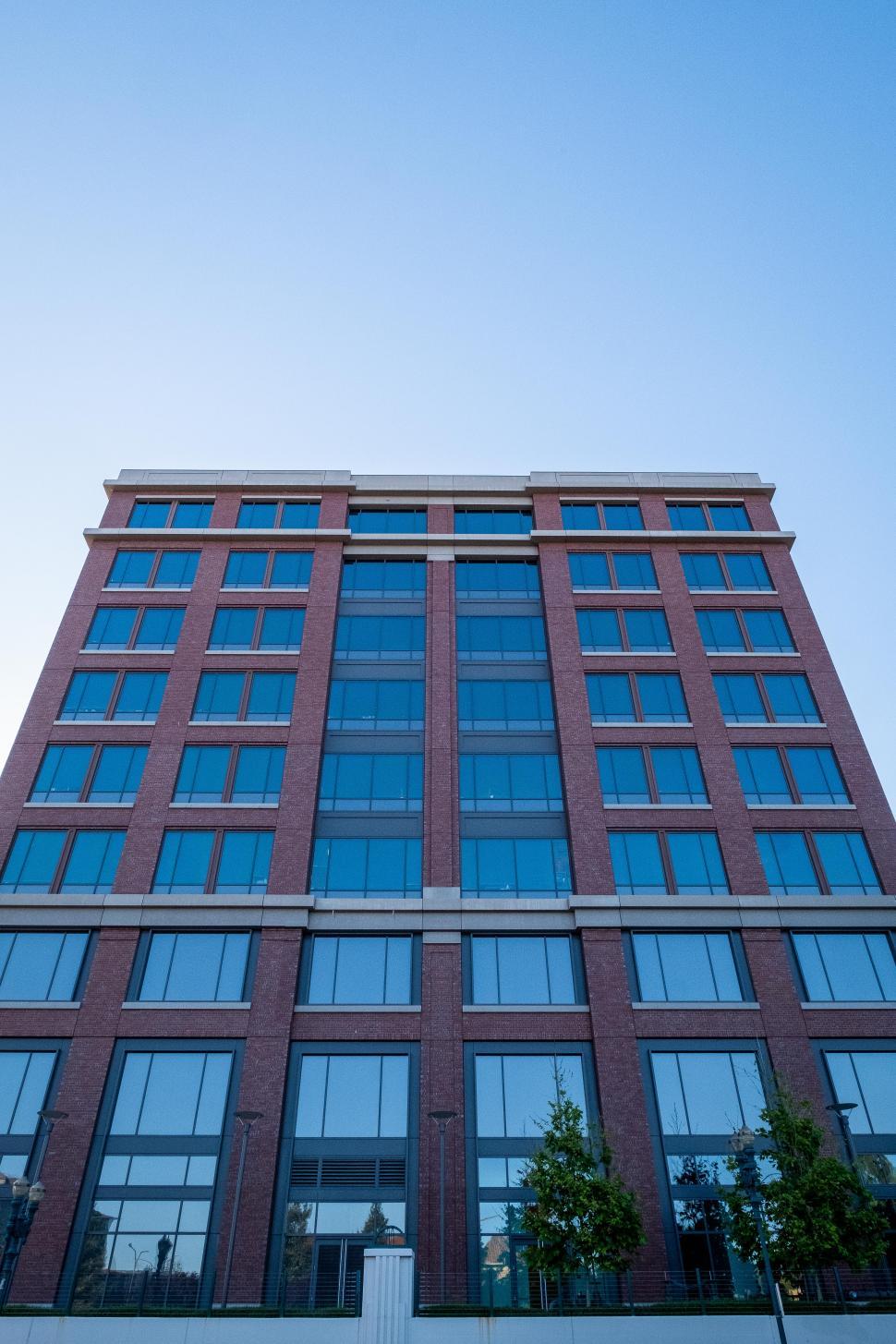 Free Image of Exterior view of apartment building with clear sky 
