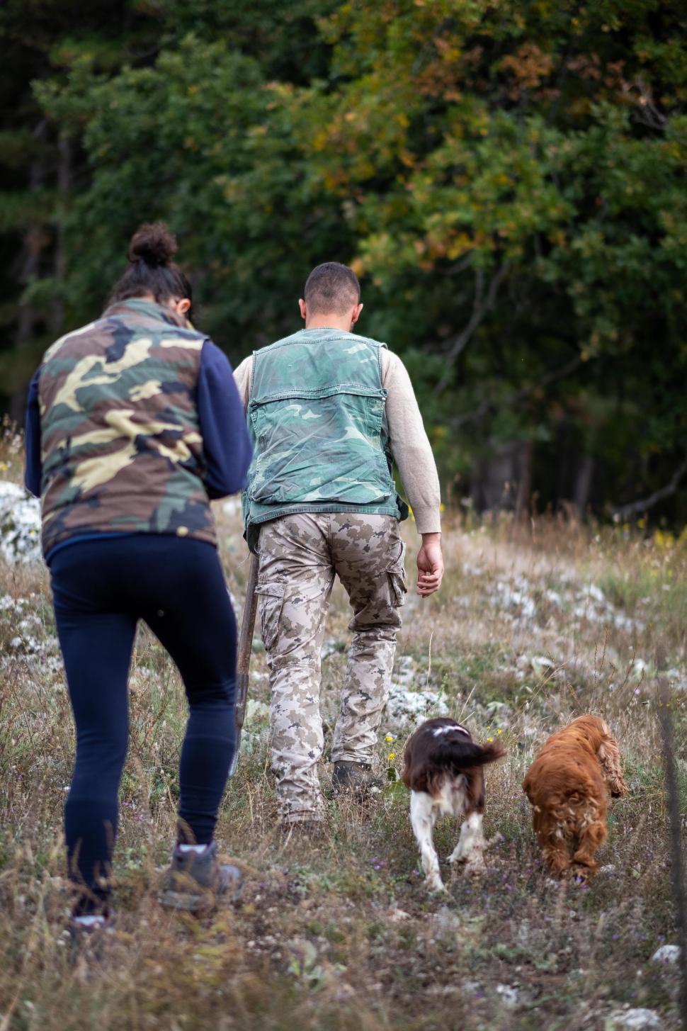 Free Image of Couple with dogs in the woods 