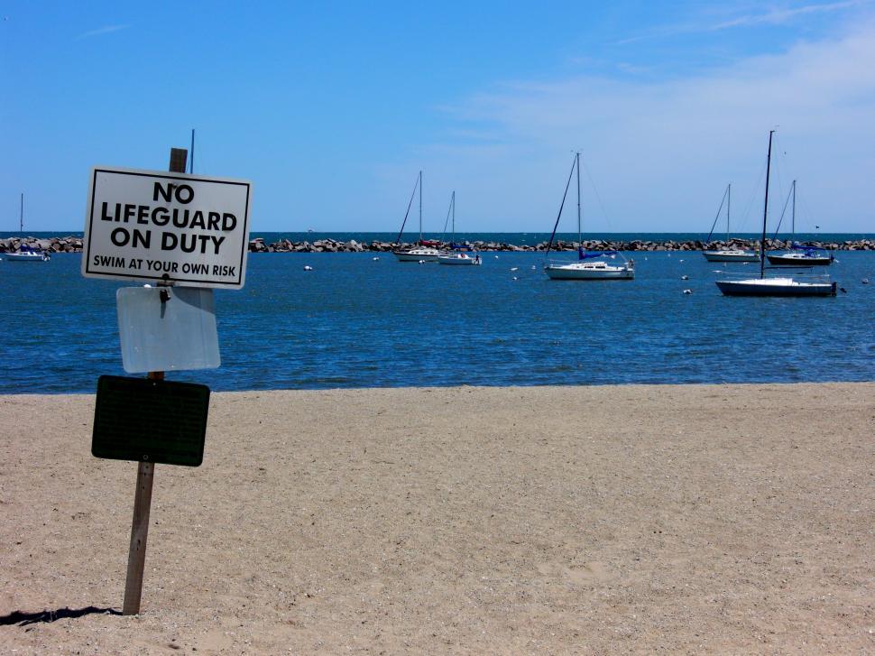 Free Image of No Lifeguard on Duty Sign at Beach 
