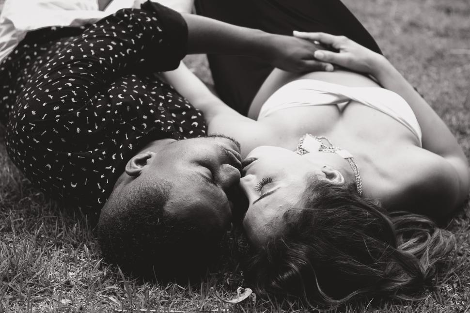 Free Image of Couple sleeping in the park - b&w 