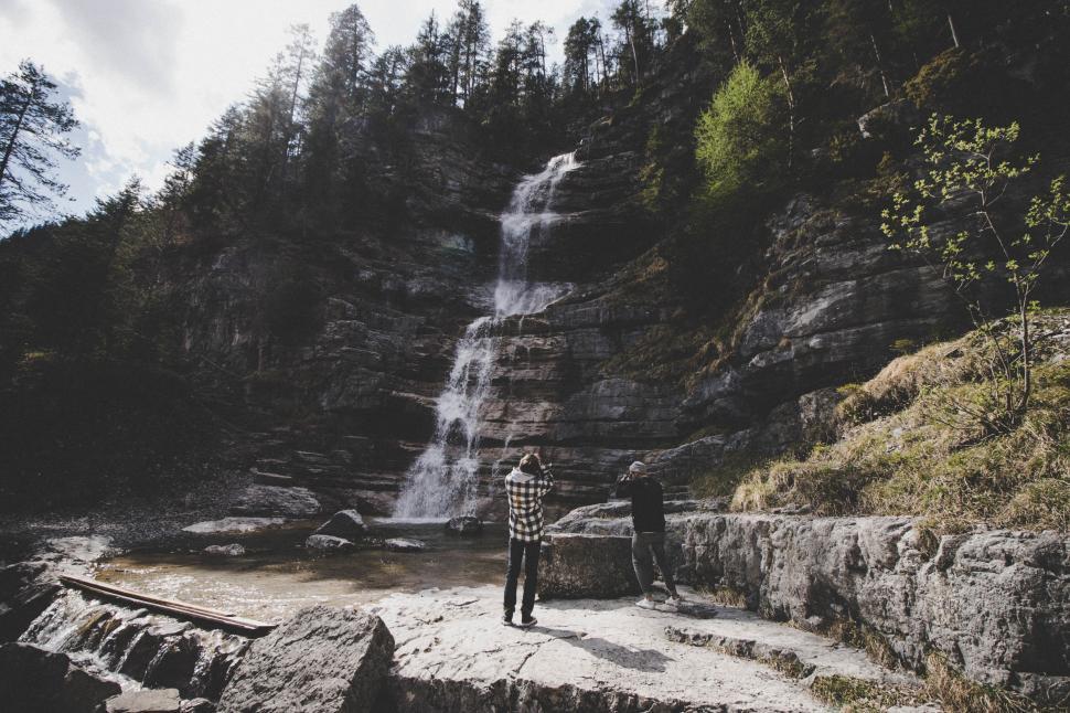 Free Image of Two male photographers and rock mountain waterfall 