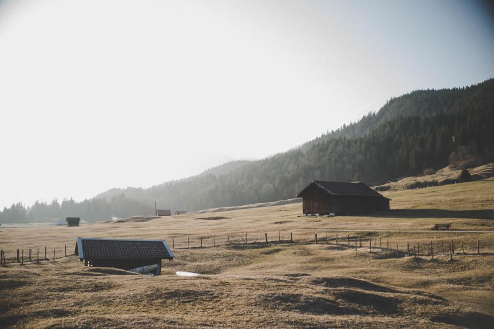 Free Image of Barns and mountains with agricultural land 