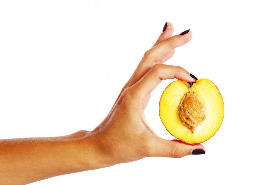 Free Image of Peach fruit in woman s hand 