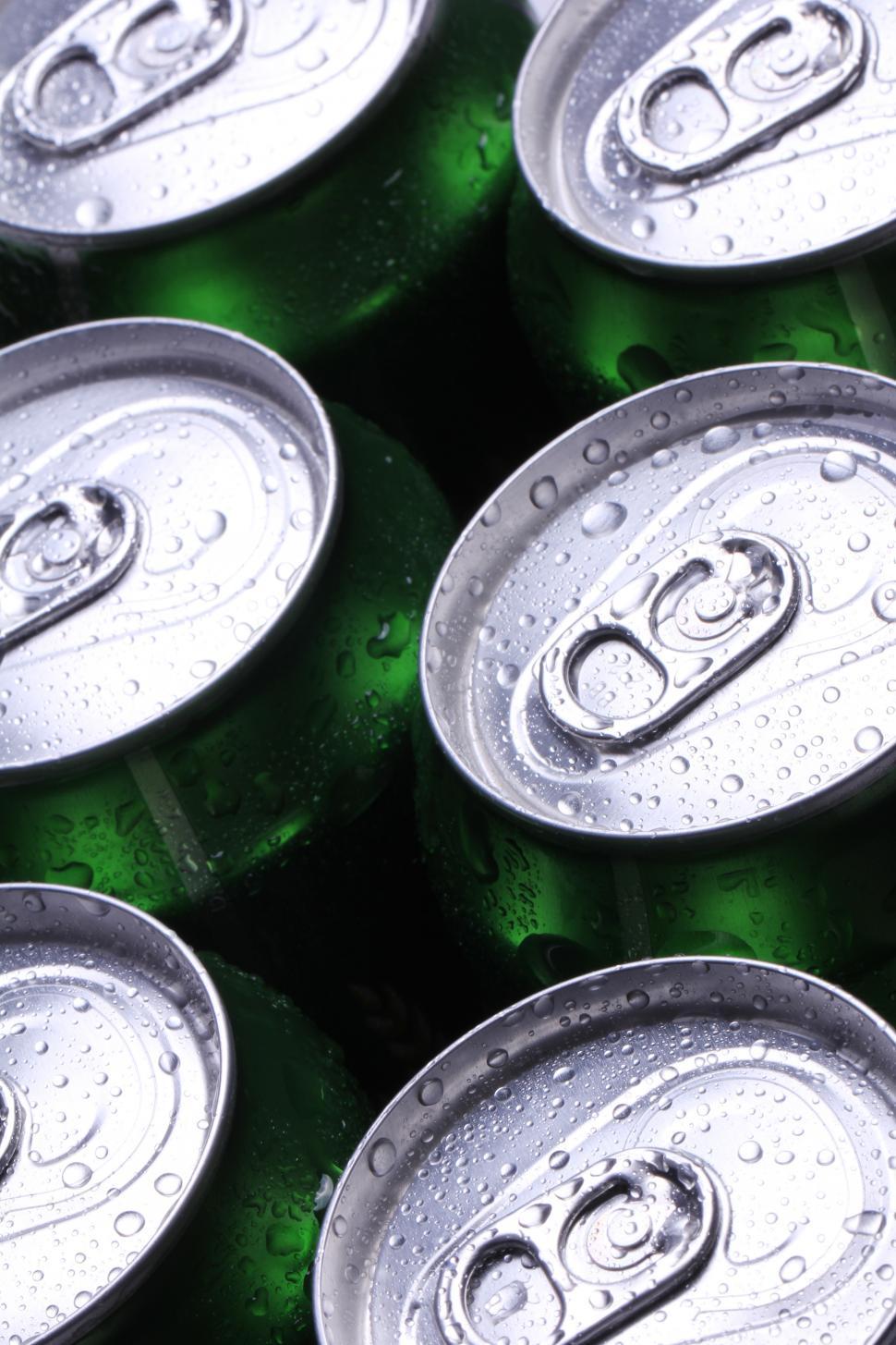 Download Free Stock Photo of Tops of aluminum cans filled with cold drink 
