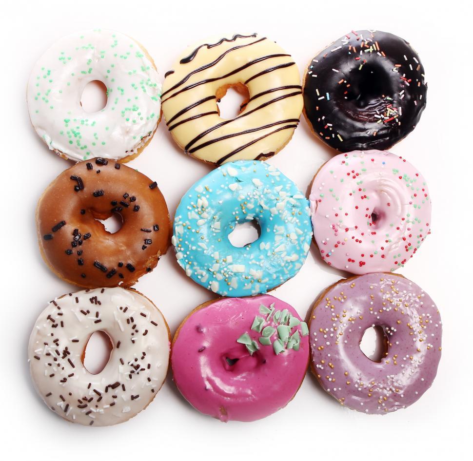Free Image of Colorful and tasty donuts laid out in a grid 