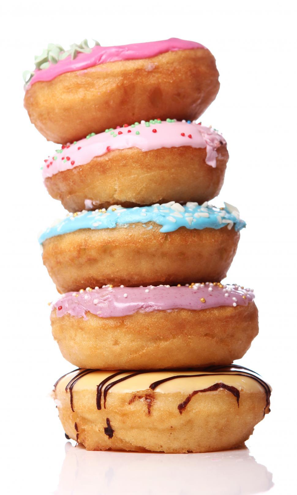 Free Image of Stack of colorful and tasty donuts 