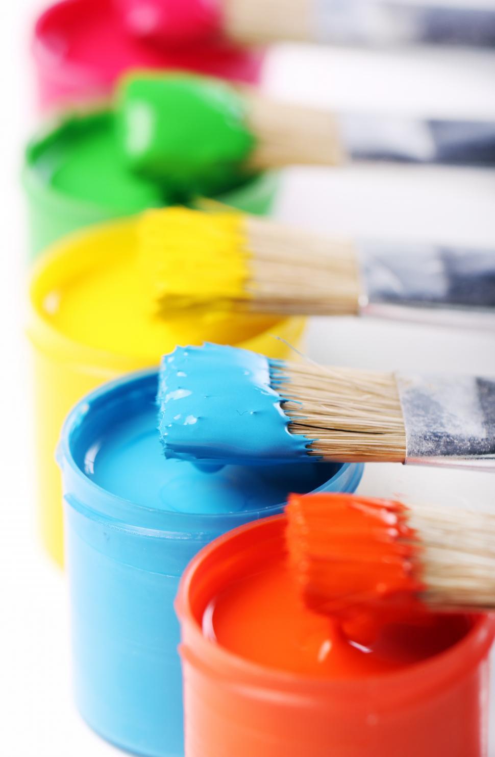Download Free Stock Photo of Paint brushes dipped in colorful paint 