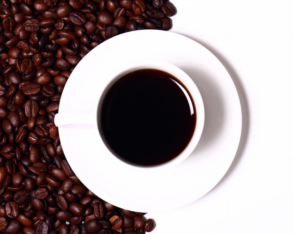 Free Image of Cup of black hot coffee, half frame of whole beans 