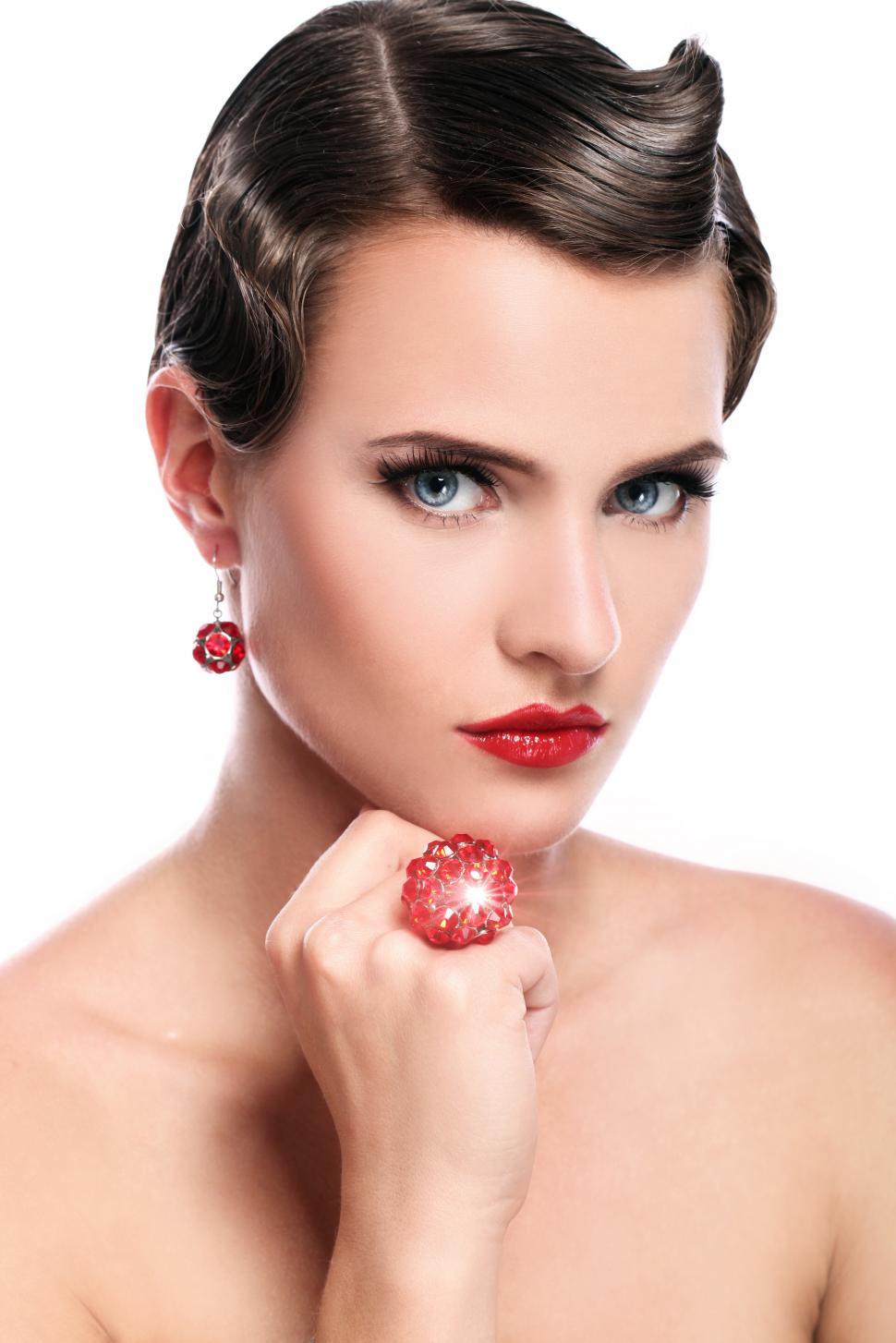 Free Image of Young woman with short dark hair and red jeweled ring 