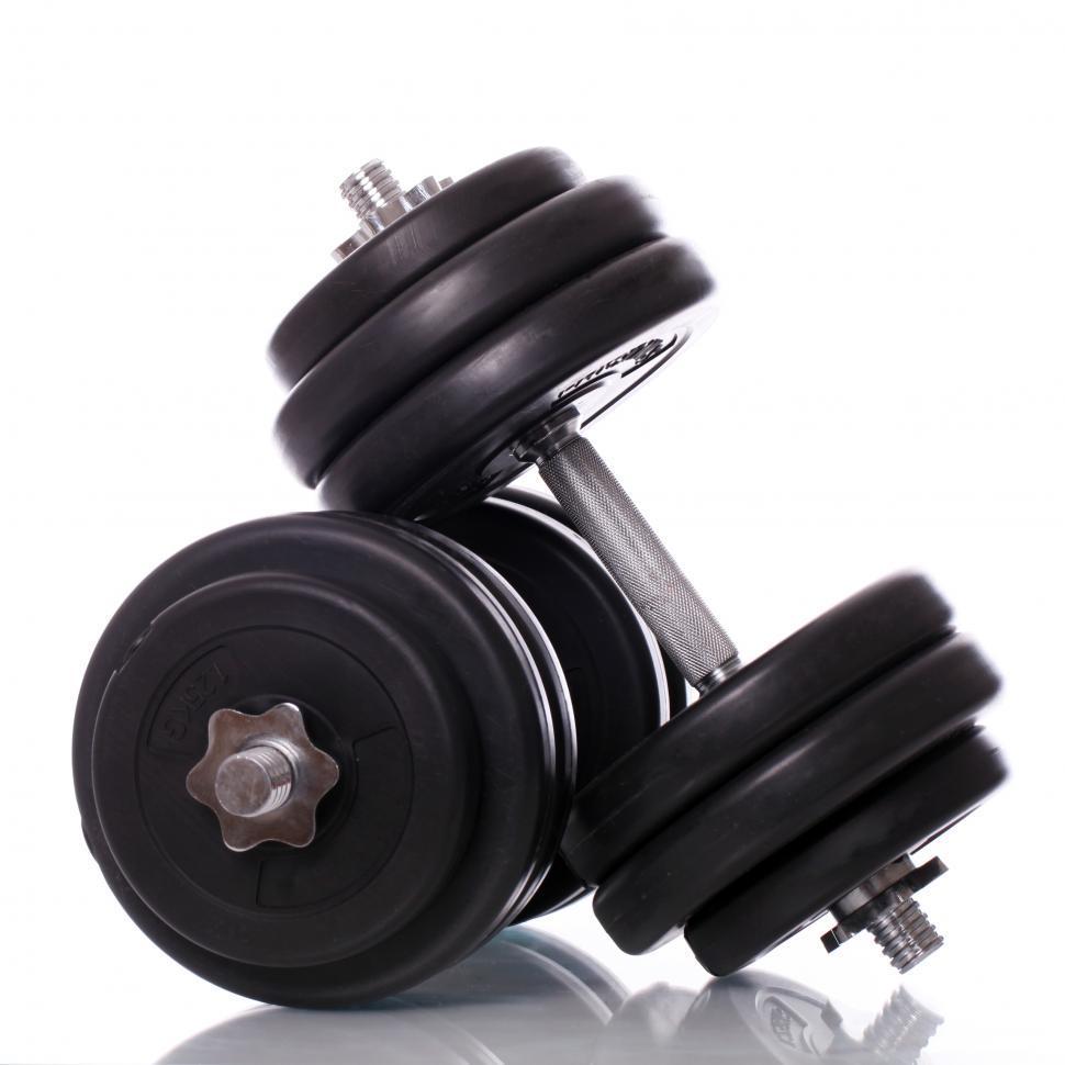 Free Image of Big dumbell weights over white background 