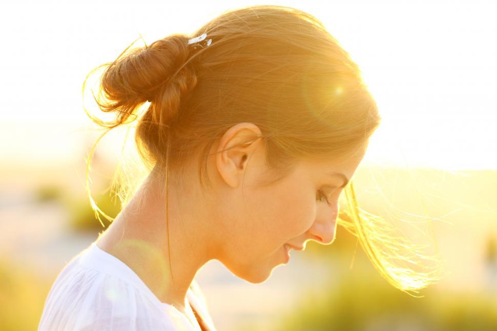 Free Image of Portrait of young woman in sunset light 