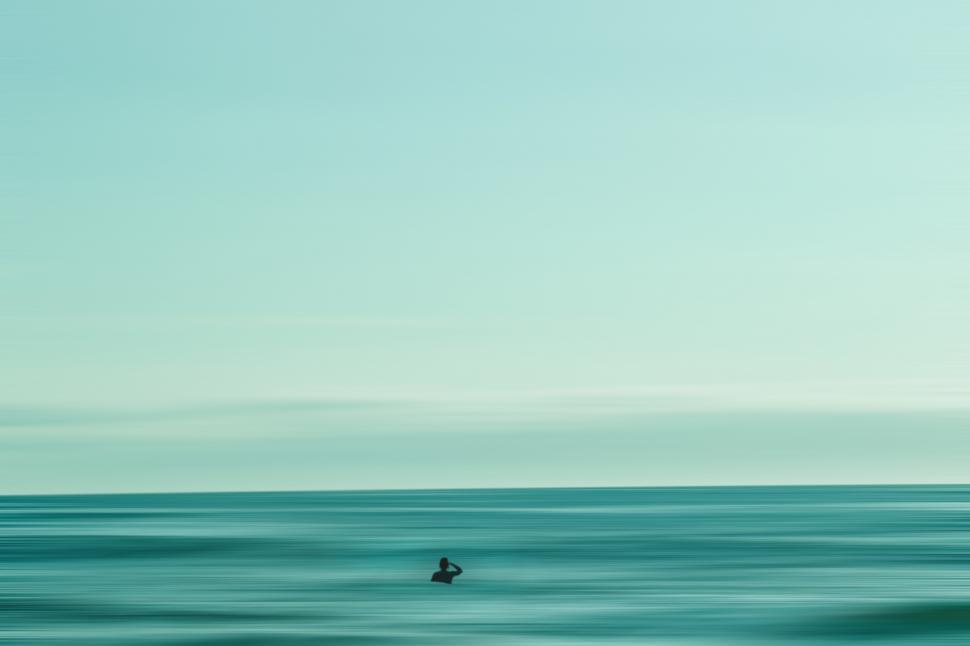 Free Image of Backside view of man in ocean - space for text 