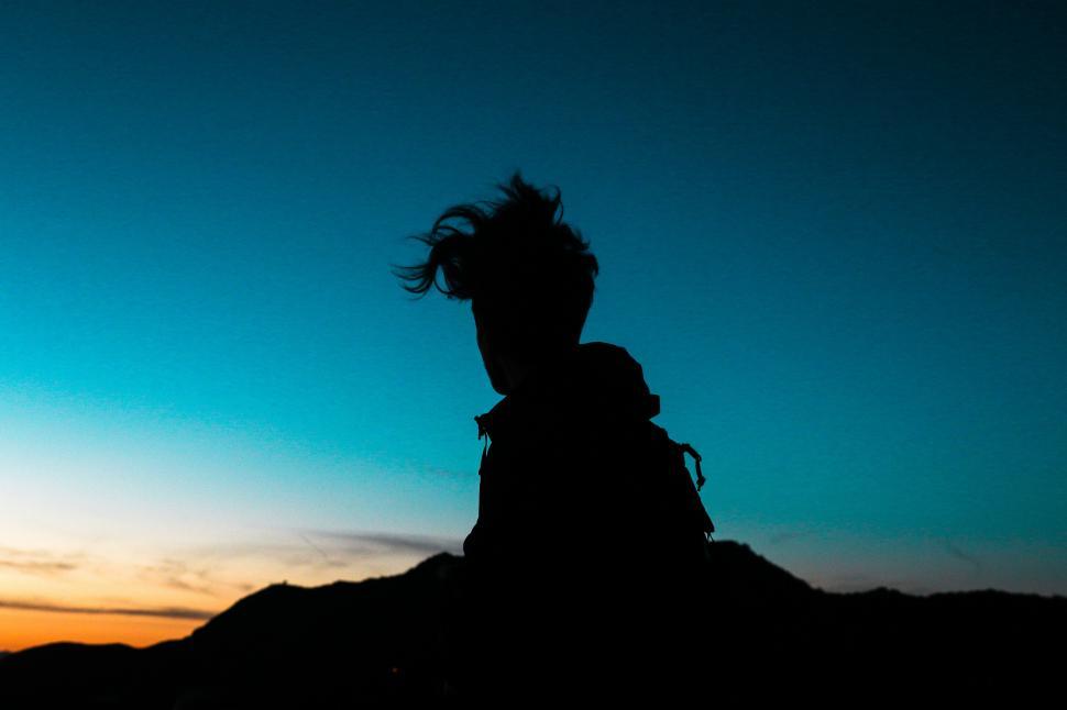 Free Image of Shadow of male hiker with sunset sky 