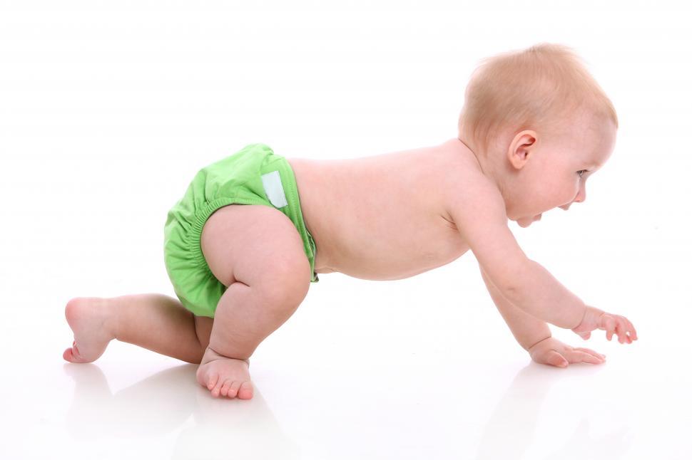 Free Image of Baby in diaper, crawling 