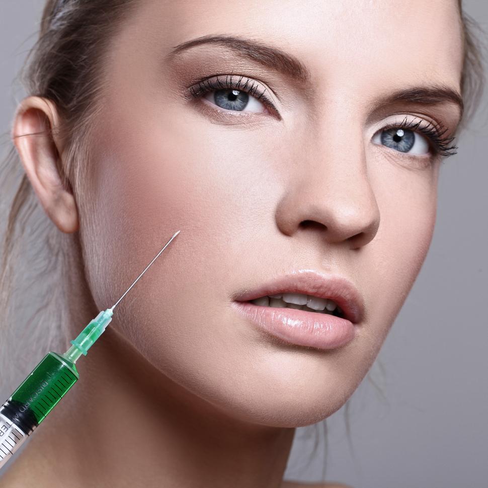 Free Image of Woman with syringe for cosmetic procedure 