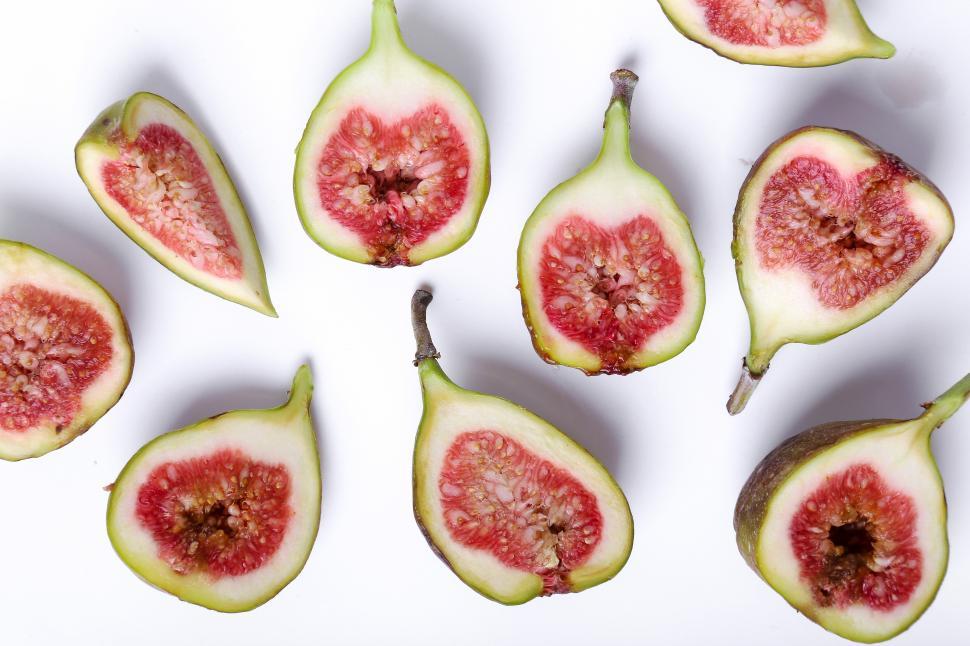 Free Image of Figs, cut in half, on white background 