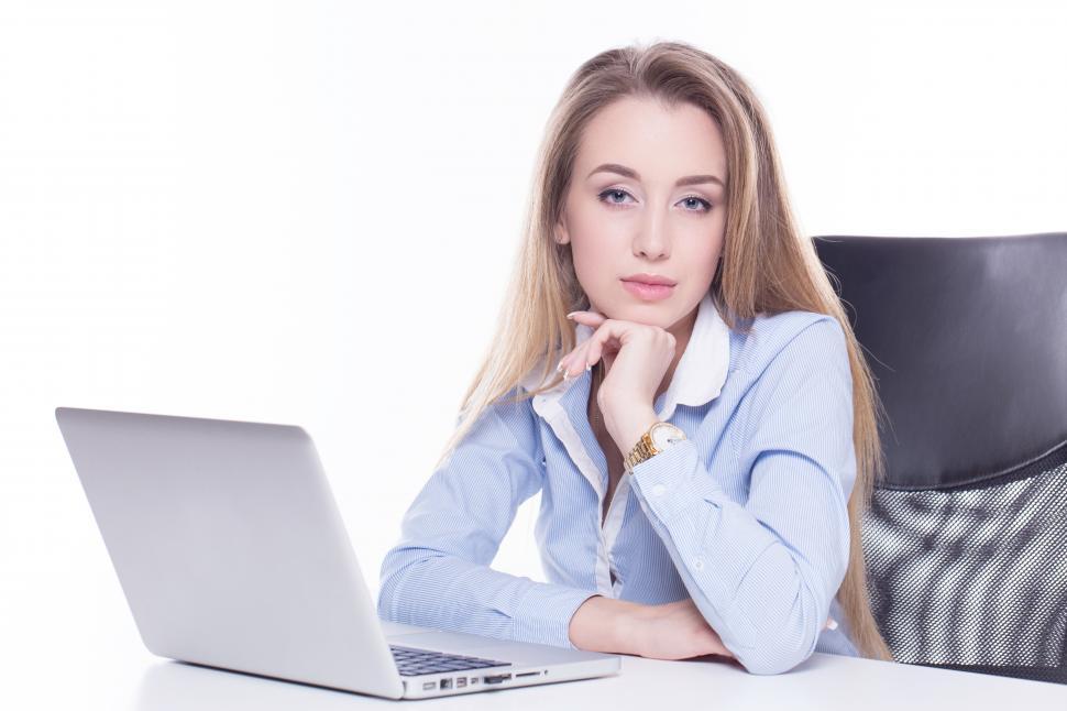 Free Image of Business woman seated, looking at camera 