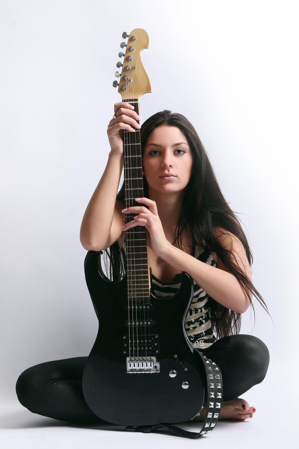 Free Image of Young woman with a guitar 