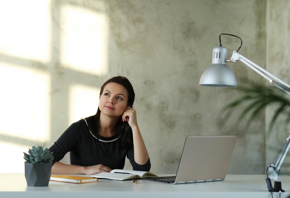 Free Image of Woman at her desk 