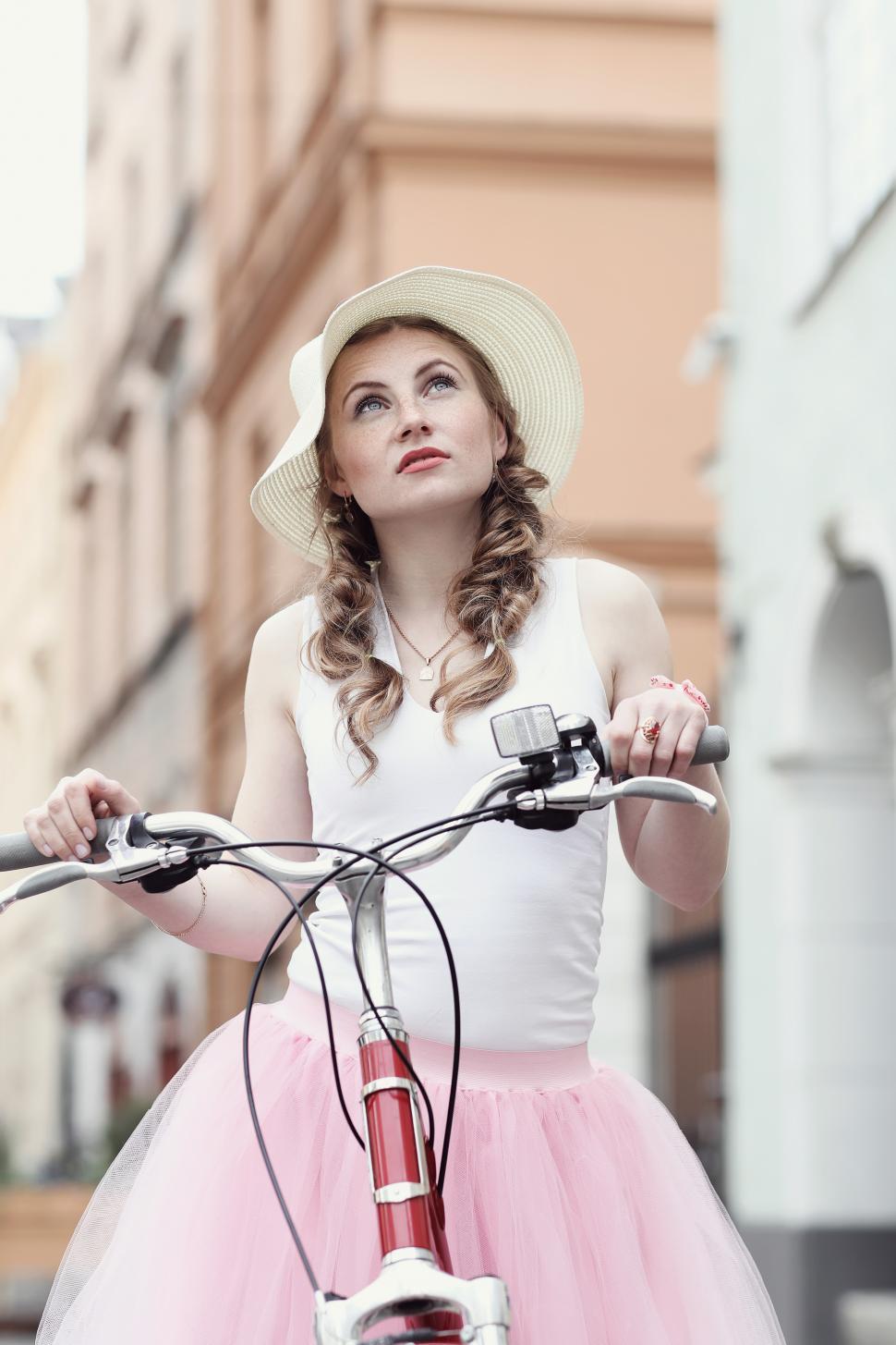 Free Image of Woman in the city with a bicycle 