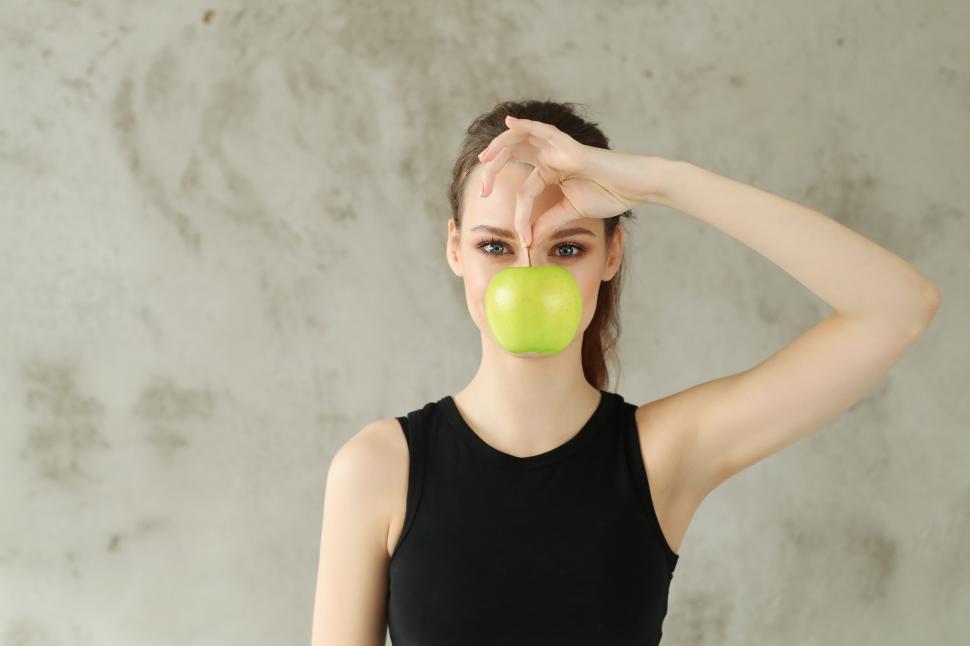 Free Image of Healthy food - woman with a green apple 