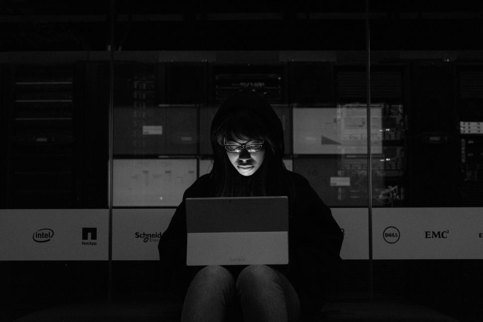 Free Image of Woman engineer with laptop in Data Center - b&w 