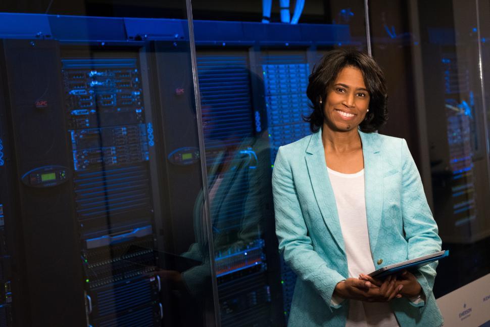 Free Image of Happy Woman engineer with tablet device in network server room 