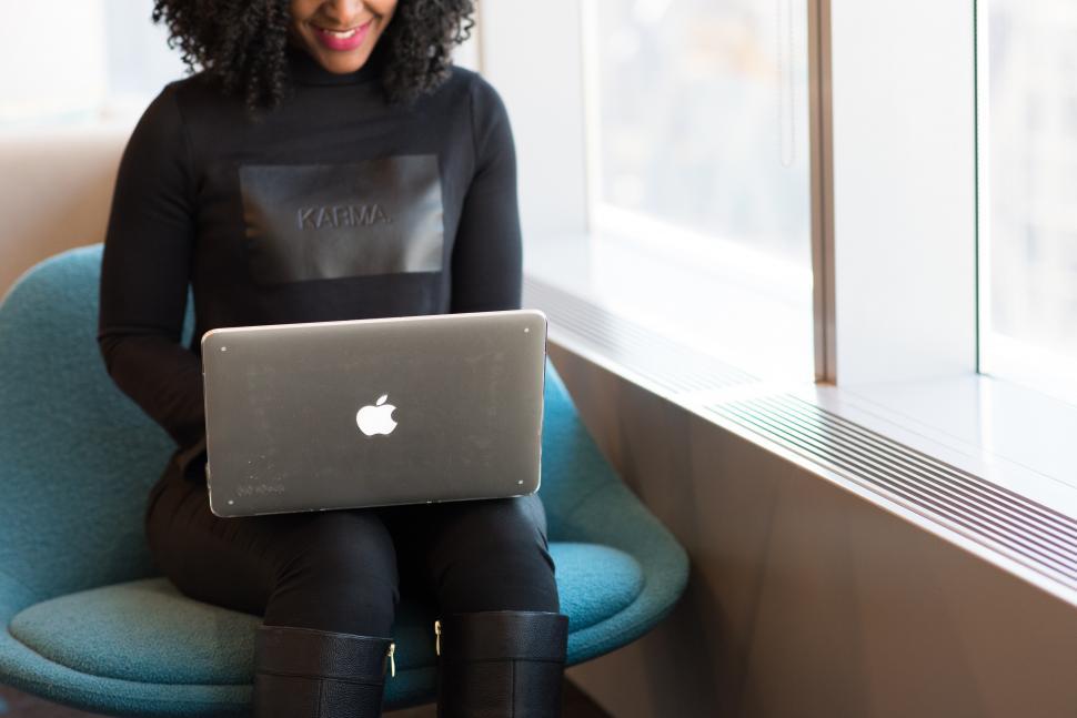 Free Image of Smiling Businesswoman in casual clothing with laptop 