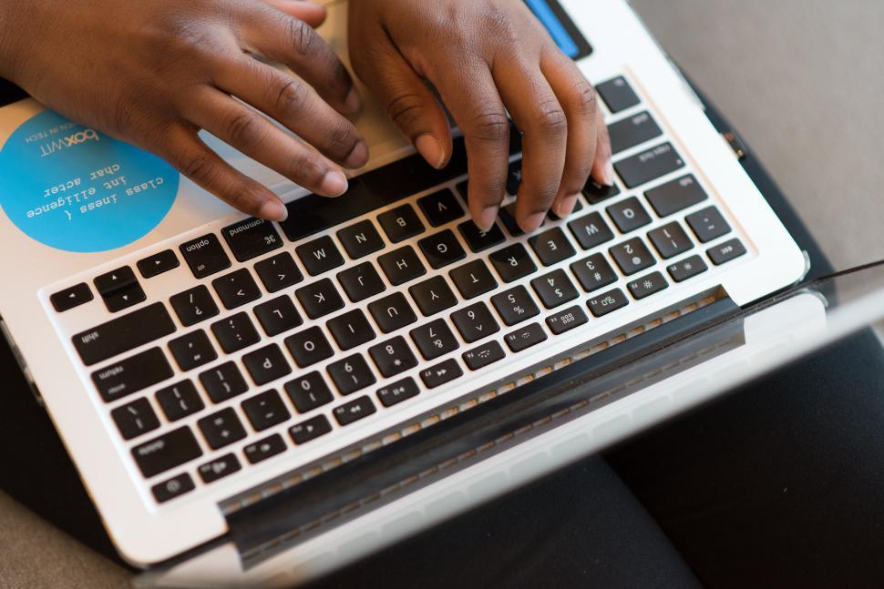 Free Image of Hands typing on laptop 