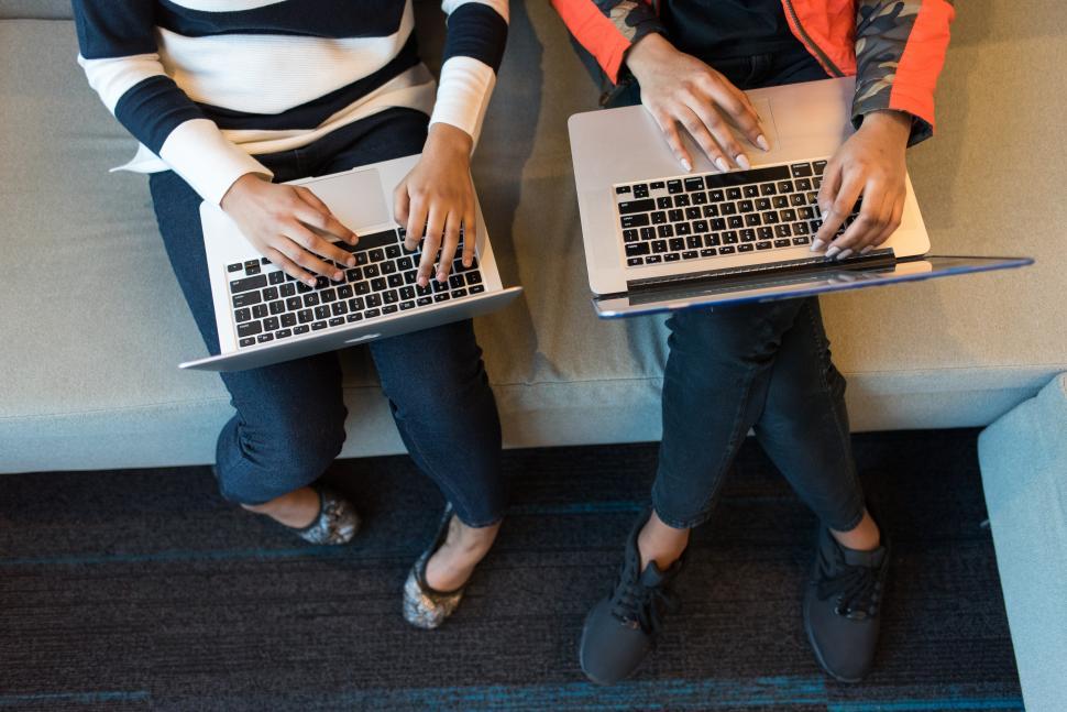 Free Image of Two businesswomen fingers on laptop keyboard 