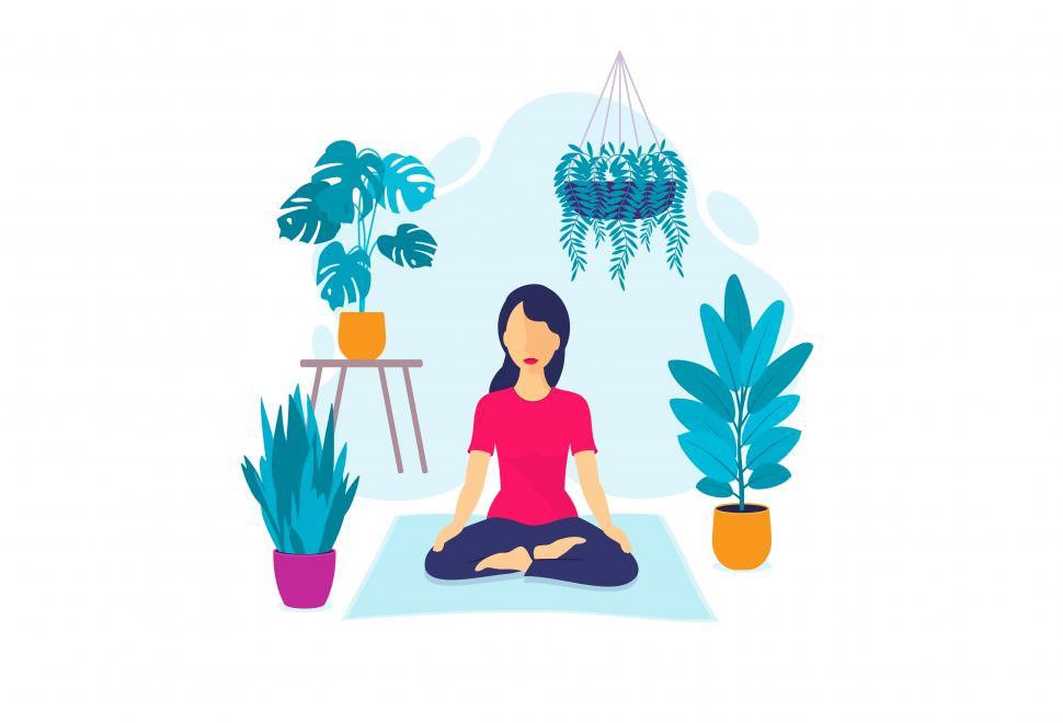 Free Image of Young Woman Meditating Indoors Surrounded by Plants 