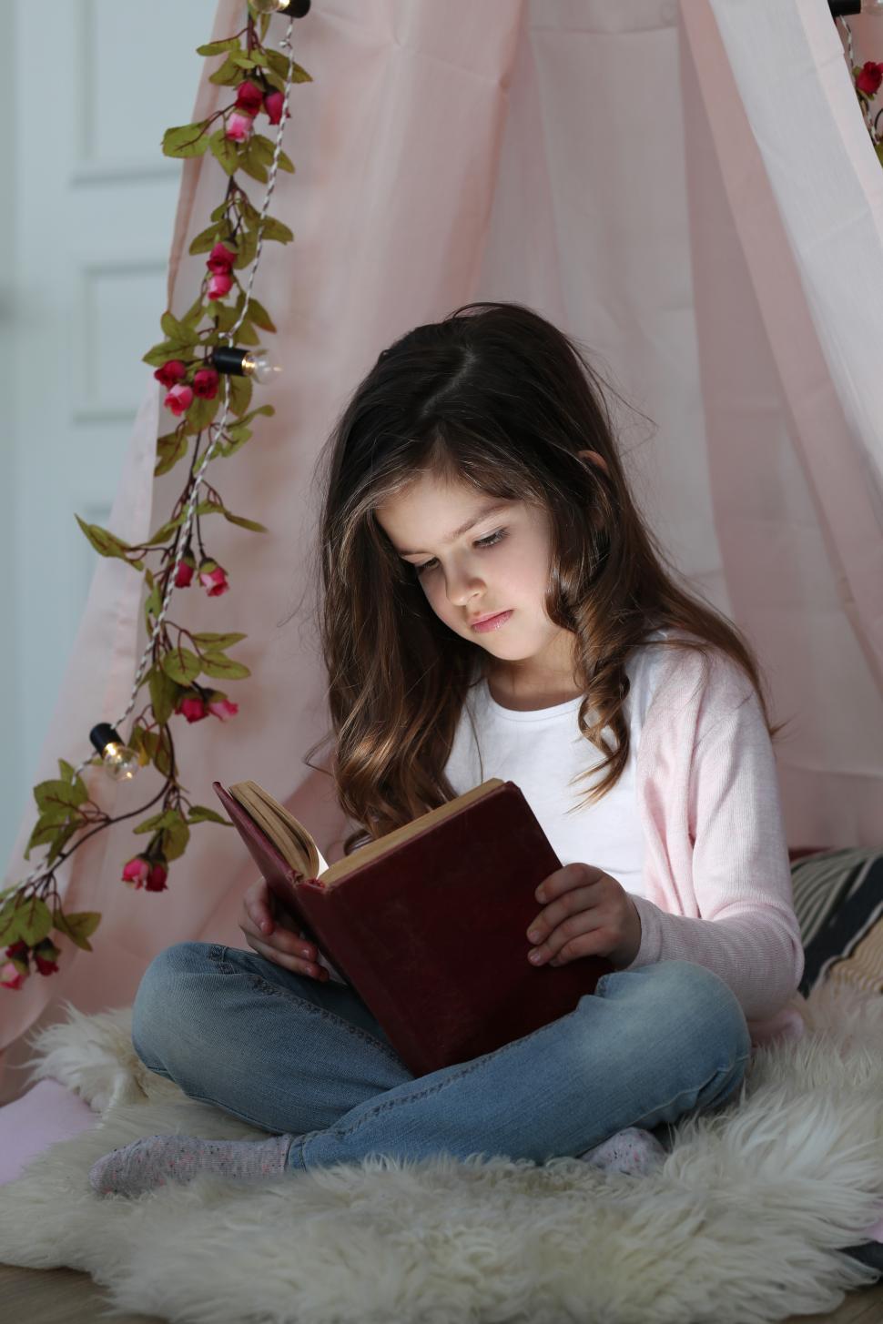 Free Image of Child reading intently 