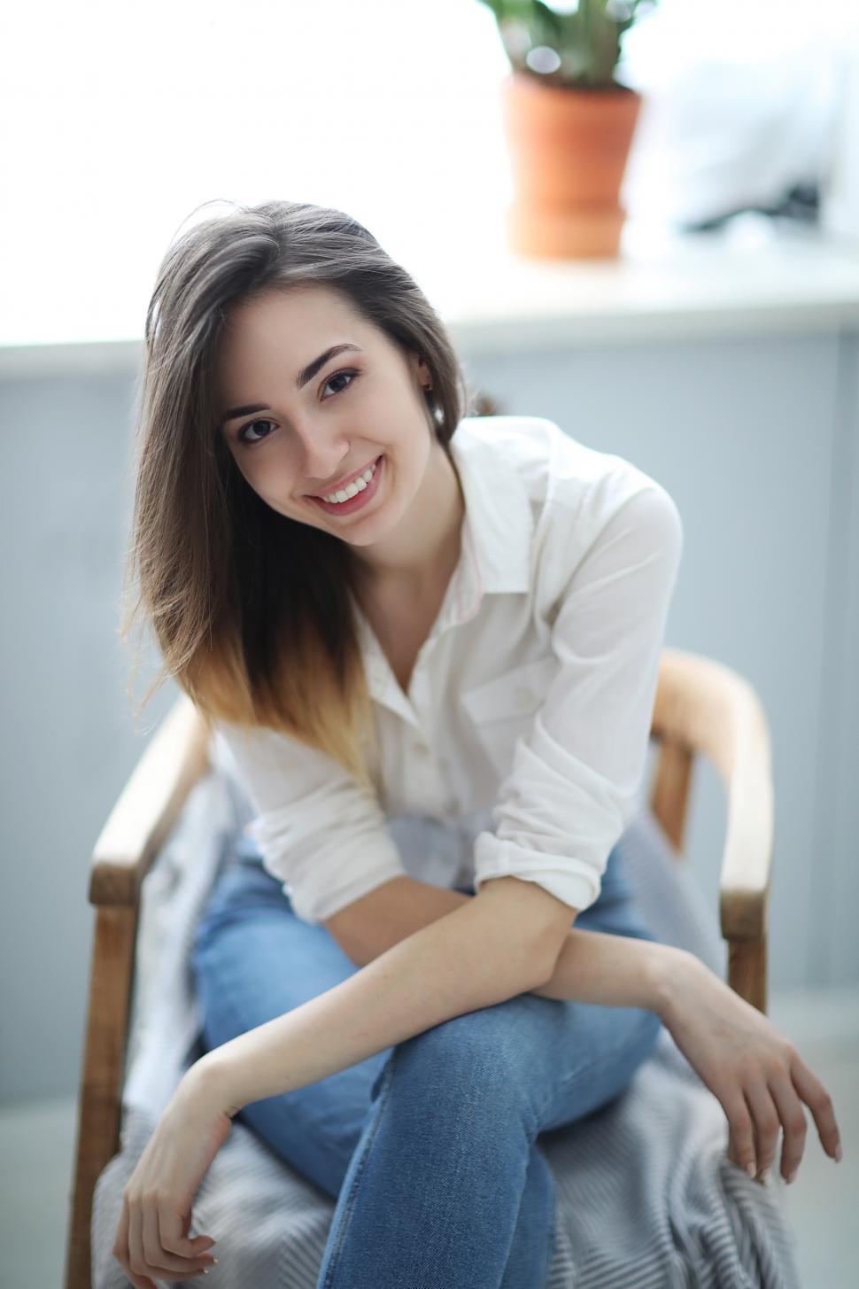 Free Image of Casual woman in chair at home 