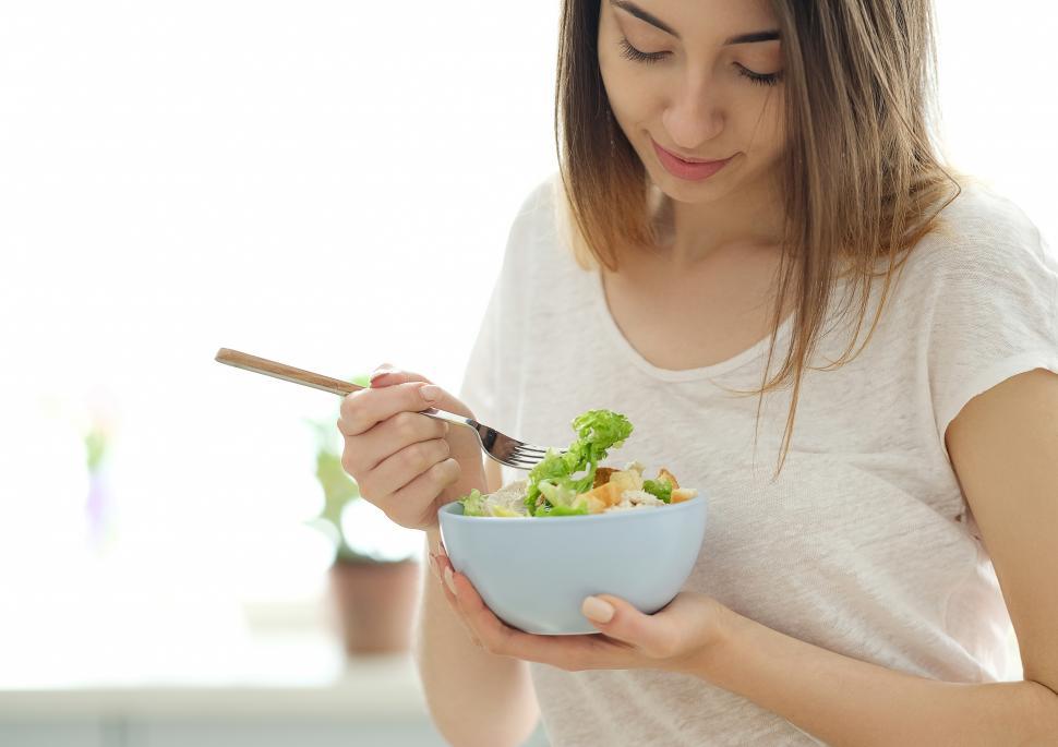 Free Image of Woman eating salad 