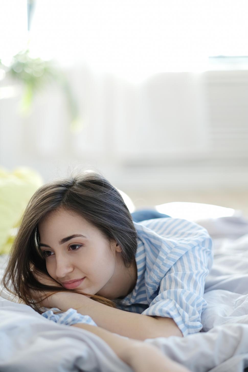 Download Free Stock Photo of Lounging thoughtfully in bed 