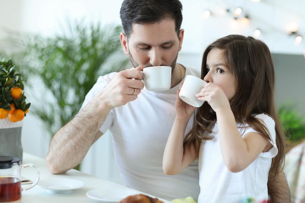 Free Image of Father and daughter having tea 