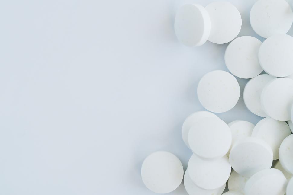 Free Image of Pharmaceutical. White pills on white background 