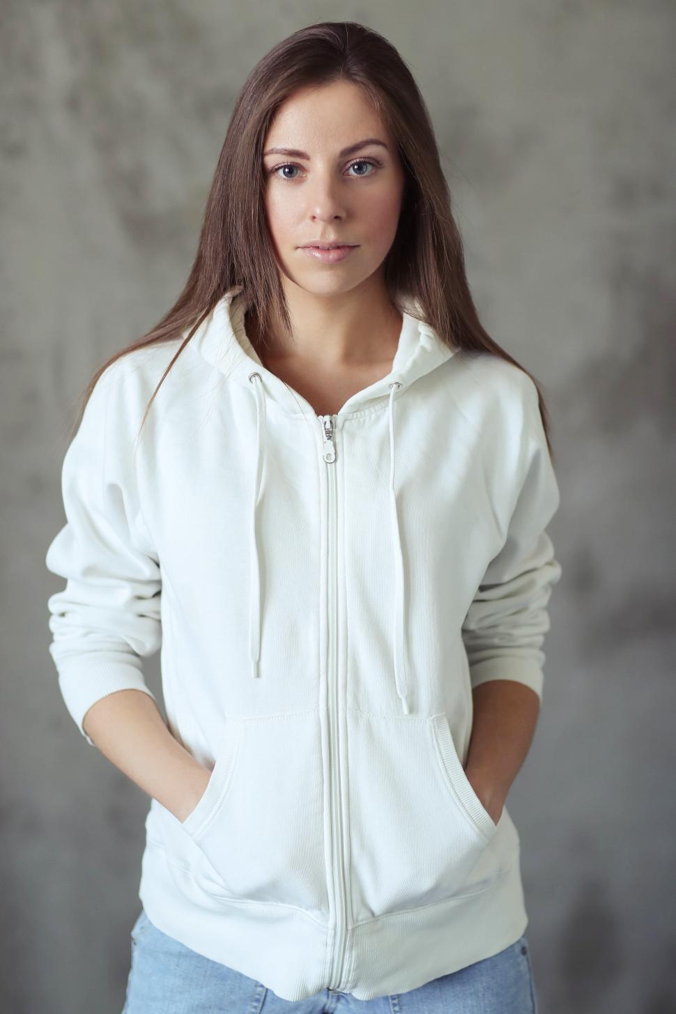Free Image of Woman in white sweatshirt jacket 