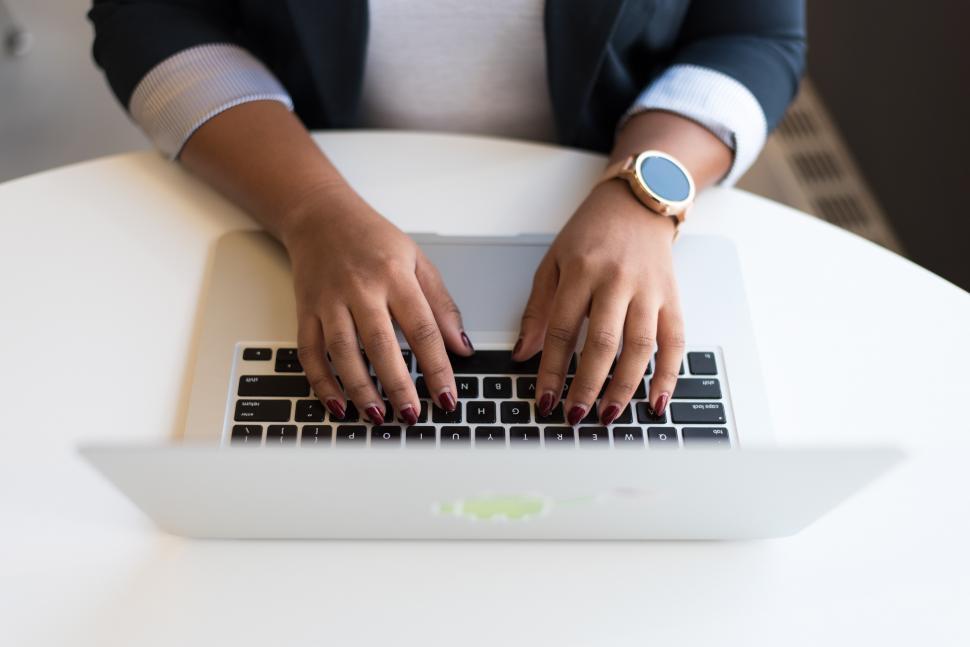 Free Image of Businesswoman hands on laptop keyboard 